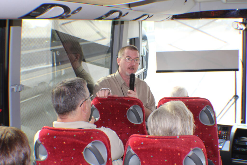 Daniel on bus Teching about tour guide